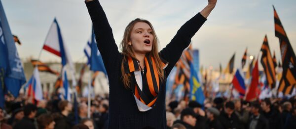 Rally and concert on Vasilyevsky Slope to mark anniversary of Crimea's reunification with Russia - Sputnik International