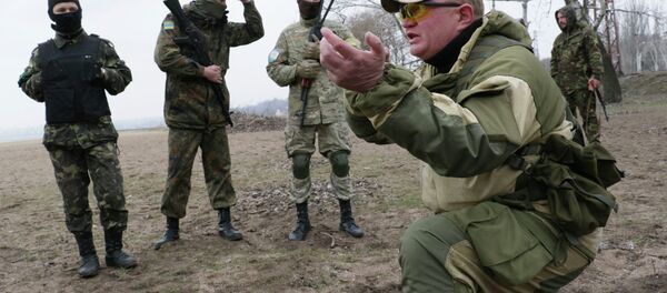 Local volunteers practice during military training exercises at a city beach near Mariupol, in the Donetsk region of Ukraine. Local volunteers practice during military training exercises at a city beach near Mariupol, in the Donetsk region of Ukraine. - Sputnik International