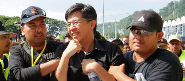 Malaysian lawmaker Tian Chua is arrested by police officers near the Perak state assembly in Ipoh, Malaysia, Thursday, May 7, 2009. File photo Malaysian lawmaker Tian Chua is arrested by police officers near the Perak state assembly in Ipoh, Malaysia, Thursday, May 7, 2009. File photo - Sputnik International