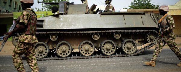 Nigerian troops patrol in the north-eastern Nigerian city of Mubi, some 20 kms (14 miles) west of the Cameroon border - Sputnik International