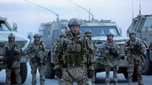German soldiers stand guard during the NATO Secretary-General Jens Stoltenberg's visit, 2014. - Sputnik International