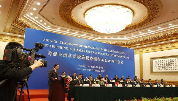 Chinese Finance Minister Lou Jiwei (2nd L) gives a speech for guests at the signing ceremony of the Asian Infrastructure Investment Bank at the Great Hall of the People in Beijing - Sputnik International