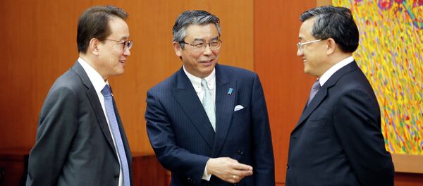 Japan's Deputy Minister of Foreign Affairs Shinsuke Sugiyama, center, talks with South Korea's Deputy Minister for Political Affairs Lee Kyung-Soo, left, and China's Vice Minister of Foreign Affairs Liu Zhenmin, right. Japan's Deputy Minister of Foreign Affairs Shinsuke Sugiyama, center, talks with South Korea's Deputy Minister for Political Affairs Lee Kyung-Soo, left, and China's Vice Minister of Foreign Affairs Liu Zhenmin, right. - Sputnik International