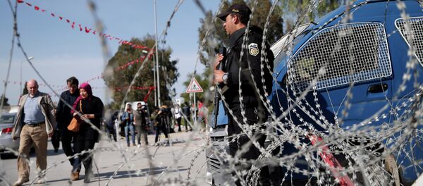People walk by as a police officer guards the National Bardo Museum in Tunis, Tunisia, Thursday, March 19, 2015 People walk by as a police officer guards the National Bardo Museum in Tunis, Tunisia, Thursday, March 19, 2015 - Sputnik International
