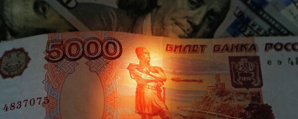 Banknotes of US dollars and rubles - Sputnik International