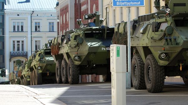 In an interview for Finnish television, Finland's Finance Minister voiced his view that now is not the right time for Finland to join the Western military alliance, Finnish Broadcasting Company YLE reports. Photo: Finnish Defense Forces armored vehicles in Helsinki, Finland. - Sputnik International