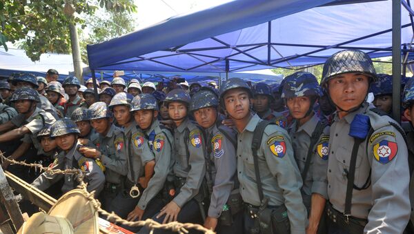 Myanmar riot police keep watch during a student protest march in Letpadan town, some 130 kilometres (80 miles) north of Myanmar's main city - Sputnik International