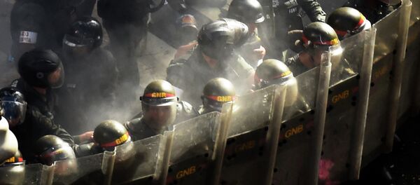 Venezuela's National Guard personnel in riot gear form a line during a protest by opponents to the government of Venezuelan President Nicolas Maduro in Caracas Venezuela's National Guard personnel in riot gear form a line during a protest by opponents to the government of Venezuelan President Nicolas Maduro in Caracas - Sputnik International