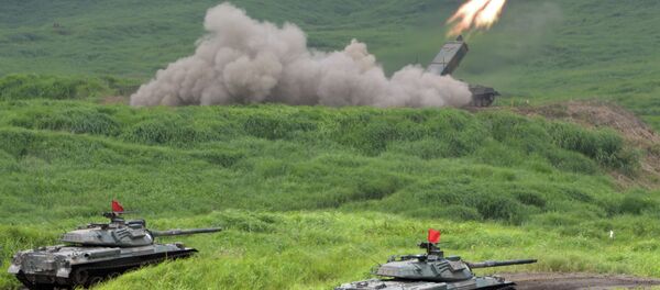 Japan Ground Self Defense Forces' type 92 anti-landmine missile fires while 74 tanks standing by during an exercise in its Higashi-Fuji training ground in Gotemba - Sputnik International