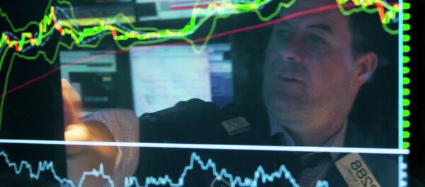 Specialist Michael McDonnell is reflected in a screen at his post on the floor of the New York Stock Exchange, Friday, March 20, 2015. Specialist Michael McDonnell is reflected in a screen at his post on the floor of the New York Stock Exchange, Friday, March 20, 2015. - Sputnik International