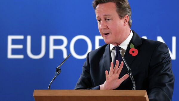 British Prime Minister David Cameron speaks during a media conference after an EU summit at the EU Council building in Brussels - Sputnik International