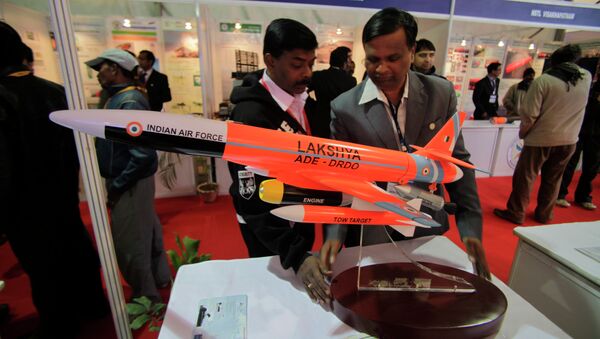 An Indian delegate displays a model of Lakshya, remotely piloted high speed target drone system developed by the Indian Defense Research and Development Organization (DRDO), at the 101st Indian Science Congress in Jammu, India - Sputnik International