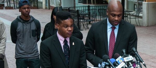Martese Johnson's lawyer reading a statement to the gathered media on Charlottesville's downtown mall - Sputnik International