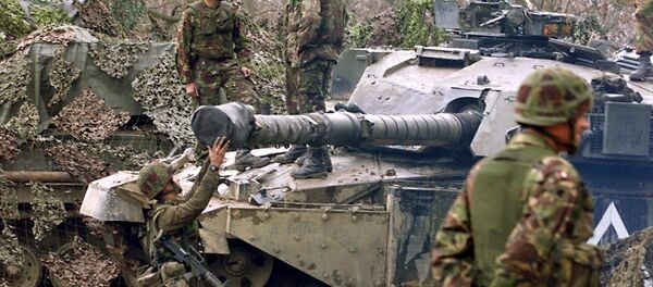 British 'tankers' from the fourth royal armoured brigade with Challenger tanks hold their position near Skopje airport 27 March 1999. British 'tankers' from the fourth royal armoured brigade with Challenger tanks hold their position near Skopje airport 27 March 1999. - Sputnik International