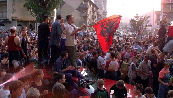 About 1,000 young Kosovar Albanians celebrate the UCK [Kosovo Liberation Army] victory over the Serbs with NATO's help in the centre of Pristina 02 July 1999 - Sputnik International