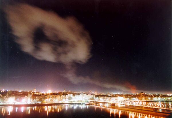 Smoke billows over the northern Yugoslav city of Novi Sad, some 70 kms. north of Belgrade after NATO air raids late Wednesday March 24, 1999. Smoke billows over the northern Yugoslav city of Novi Sad, some 70 kms. north of Belgrade after NATO air raids late Wednesday March 24, 1999. - Sputnik International