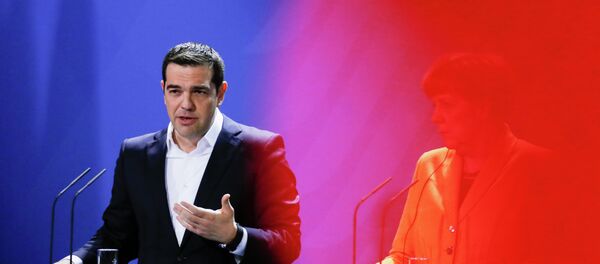 In this photo taken with a red television camera control light in the foreground, German Chancellor Angela Merkel, right, and the Prime Minister of Greece Alexis Tsipras - Sputnik International