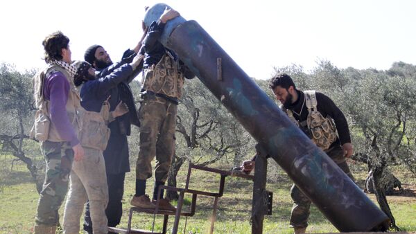 Rebel fighters from Suqour al-Sham Brigade prepare to launch a locally made shell towards forces loyal to Syria's president Bashar Al-Assad who are stationed in checkpoints surrounding the city of Idlib - Sputnik International