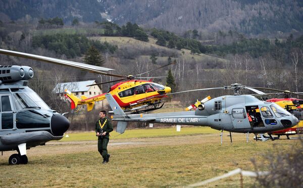 Helicopters of the French Air Force (back) and civil security services are seen in Seyne, south-eastern France, on March 24, 2015, near the site where a Germanwings Airbus A320 crashed in the French Alps. Helicopters of the French Air Force (back) and civil security services are seen in Seyne, south-eastern France, on March 24, 2015, near the site where a Germanwings Airbus A320 crashed in the French Alps. - Sputnik International