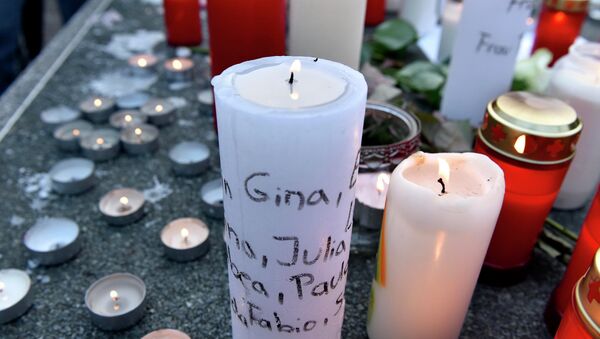 Candles with names of crash victims written on it are placed a table tennis table in front of the Joseph-Koenig Gymnasium in Haltern, western Germany. - Sputnik International