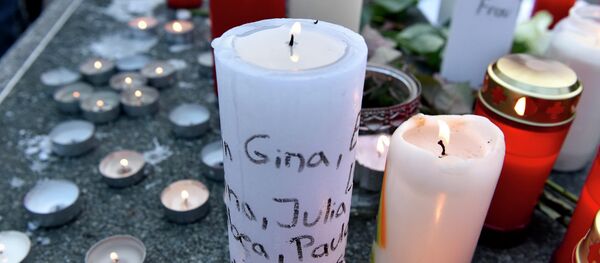 Candles with names of crash victims written on it are placed a table tennis table in front of the Joseph-Koenig Gymnasium in Haltern, western Germany. - Sputnik International