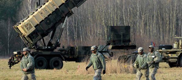 U.S soldiers walk next to a Patriot missile defence battery U.S soldiers walk next to a Patriot missile defence battery - Sputnik International