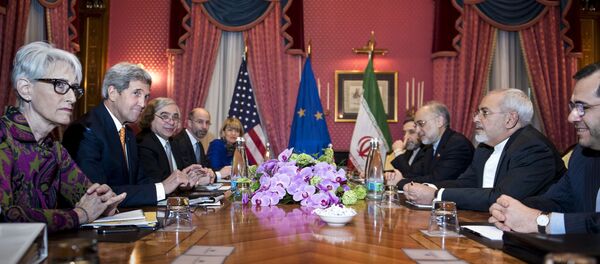 U.S. Secretary of State John Kerry waits with other officials for the start of a meeting at the Beau Rivage Palace Hotel in Lausanne U.S. Secretary of State John Kerry waits with other officials for the start of a meeting at the Beau Rivage Palace Hotel in Lausanne - Sputnik International