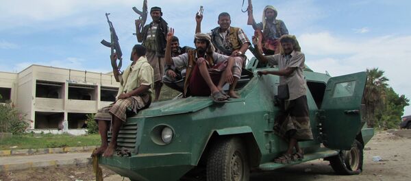 Militiamen loyal to President Abed Rabbo Mansour Hadi ride on an army vehicle on a street in Aden, Yemen Militiamen loyal to President Abed Rabbo Mansour Hadi ride on an army vehicle on a street in Aden, Yemen - Sputnik International