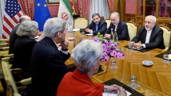 (From left) Robert Malley, of the US National Security Council, US Secretary of Energy Ernest Moniz, US Secretary of State John Kerry, US Under Secretary for Political Affairs Wendy Sherman, Iranian Deputy Foreign Minister Abbas Araghchi, Head of Iranian Atomic Energy Organisation Ali Akbar Salehi and Iranian Foreign Minister Javad Zarif wait for a meeting at the Beau Rivage Palace Hotel March 27, 2015 in Lausanne, Switzerland - Sputnik International