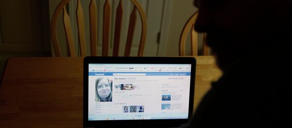 Chris Boston looks over a screen shot on his computer of the phony Facebook account that was set up in his daughter Alex's name Thursday, April 26, 2012, at their home in Acworth, Ga. Chris Boston looks over a screen shot on his computer of the phony Facebook account that was set up in his daughter Alex's name Thursday, April 26, 2012, at their home in Acworth, Ga. - Sputnik International