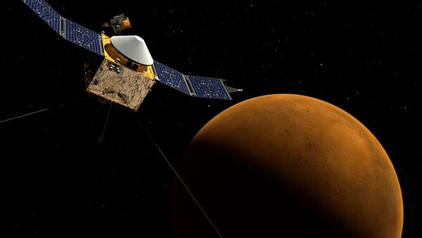 This artist's concept shows the MAVEN spacecraft orbiting Mars. - Sputnik International