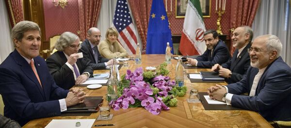 U.S. Secretary of State John Kerry (L), U.S. Secretary of Energy Ernest Moniz (2nd L), the head of the Iranian Atomic Energy Organization Ali Akbar Salehi (2nd R) and Iranian Foreign Minister Javad Zarif (R) wait with others for a meeting at the Beau Rivage Palace Hotel March 28, 2015, in Lausanne U.S. Secretary of State John Kerry (L), U.S. Secretary of Energy Ernest Moniz (2nd L), the head of the Iranian Atomic Energy Organization Ali Akbar Salehi (2nd R) and Iranian Foreign Minister Javad Zarif (R) wait with others for a meeting at the Beau Rivage Palace Hotel March 28, 2015, in Lausanne - Sputnik International