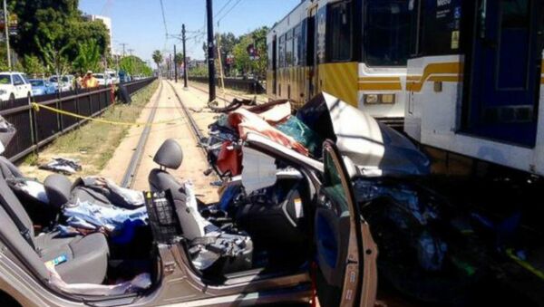 A car and metro link train collided near the USC campus in Los Angeles, Calif., March 28, 2015 - Sputnik International