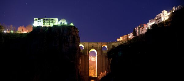 The New Bridge of Ronda is enlightened from behind during the global climate change awareness campaign Earth Hour, on March 28, 2015 The New Bridge of Ronda is enlightened from behind during the global climate change awareness campaign Earth Hour, on March 28, 2015 - Sputnik International