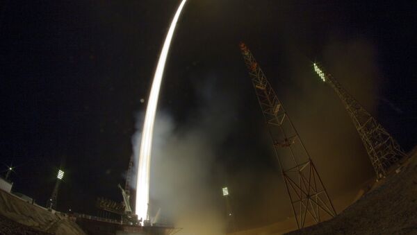 In this photo taken with a fisheye lens and with long time exposure the Soyuz-FG rocket booster with Soyuz TMA-16M space ship carrying a new crew to the International Space Station, ISS, blasts off at the Russian leased Baikonur cosmodrome, Kazakhstan, Saturday, March 28, 2015 - Sputnik International