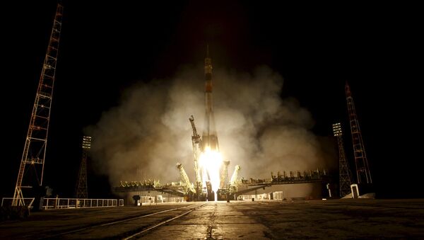 The Soyuz TMA-16M spacecraft carrying the International Space Station crew of Mikhail Kornienko and Gennady Padalka of Russia and Scott Kelly of the U.S. blasts off from the launch pad at the Baikonur cosmodrome March 28, 2015 - Sputnik International