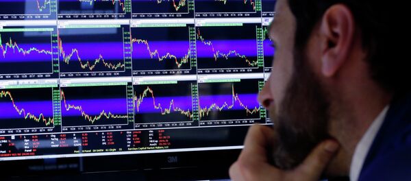 Specialist Michael Pistillo watches his screens at his post on the floor of the New York Stock Exchange, Friday, March 6, 2015 - Sputnik International