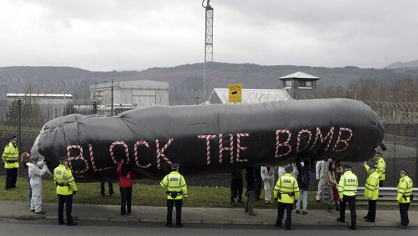 Campaigners hold an inflatable during a protest in front of the Trident submarine fleet naval base in Faslane, Scotland, 14 March 2007 - Sputnik International