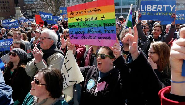 Demonstrators gather at Monument Circle to protest a controversial religious freedom bill recently signed by Governor Mike Pence during a rally in Indianapolis March 28, 2015 - Sputnik International