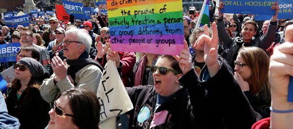 Demonstrators gather at Monument Circle to protest a controversial religious freedom bill recently signed by Governor Mike Pence during a rally in Indianapolis March 28, 2015 - Sputnik International