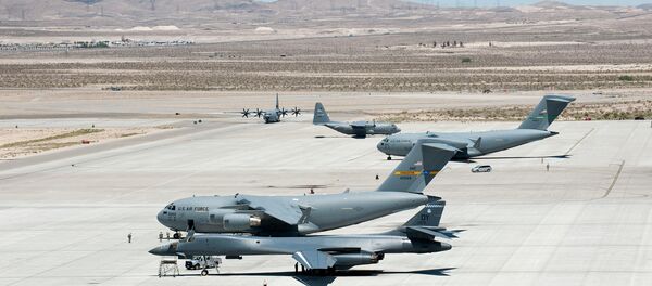 Several C-17 Globemaster IIIs, C-130 Hercules and a B-1 Lancer park on the flightline May 31, 2013, at Nellis Air Force Base, Nev - Sputnik International