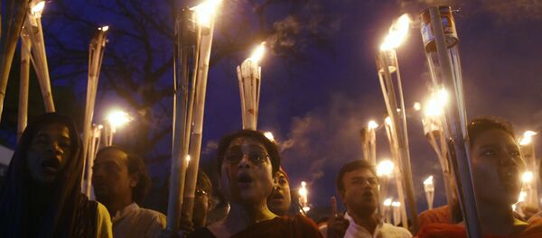 Bangladeshi secular activists take part in a torch-lit protest against the killing of US blogger of Bangladeshi origin and founder of the Mukto-Mona (Free-mind) blog site, Avijit Roy Bangladeshi secular activists take part in a torch-lit protest against the killing of US blogger of Bangladeshi origin and founder of the Mukto-Mona (Free-mind) blog site, Avijit Roy - Sputnik International