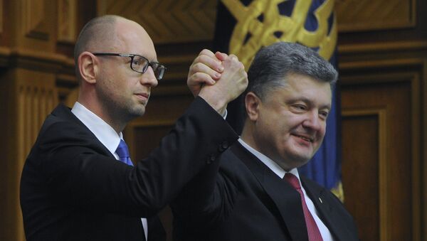Ukraine's President Petro Poroshenko, right, celebrates with Arseniy Yatsenyuk after Yatsenyuk was appointed as Prime Minister during the opening first session of the Ukrainian parliament in Kiev - Sputnik International