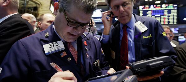 Trader John Panin, left, works on the floor of the New York Stock Exchange Trader John Panin, left, works on the floor of the New York Stock Exchange - Sputnik International