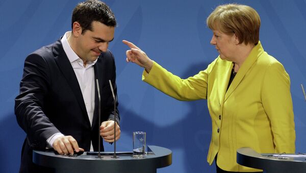 German Chancellor Angela Merkel (right) and the Prime Minister of Greece Alexis Tsipras (left) at a press conference following talks at the chancellery in Berlin, on March 23, 2015. - Sputnik International