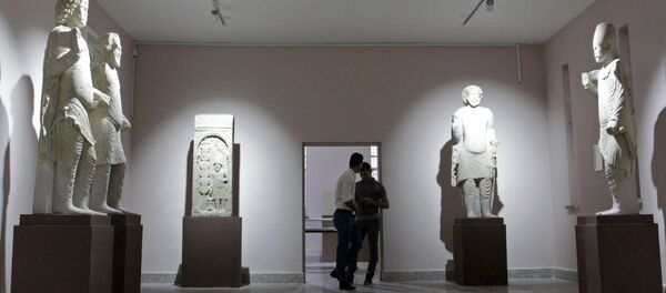 Iraqi men visit the Nassiriya Museum in Nassiriya province March 26, 2015. Nassiriya Museum has reopened for the first time since its closure in 1991 after it was looted during a Shi'ite uprising in southern Iraq. Picture taken March 26 2015 Iraqi men visit the Nassiriya Museum in Nassiriya province March 26, 2015. Nassiriya Museum has reopened for the first time since its closure in 1991 after it was looted during a Shi'ite uprising in southern Iraq. Picture taken March 26 2015 - Sputnik International