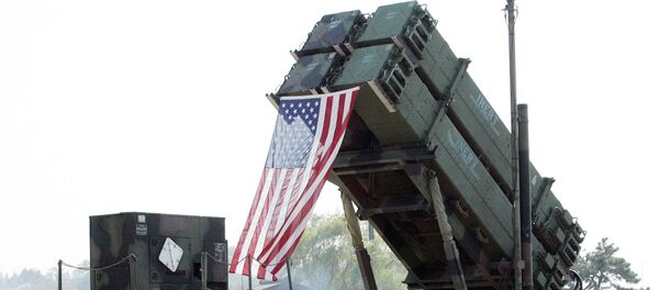 South Korean visitors shelter from the sun under the shadow of a U.S. Surface-to Air missile Patriot launcher during Air Power Day at the U.S. airbase in Osan, south of Seoul, South Korea South Korean visitors shelter from the sun under the shadow of a U.S. Surface-to Air missile Patriot launcher during Air Power Day at the U.S. airbase in Osan, south of Seoul, South Korea - Sputnik International