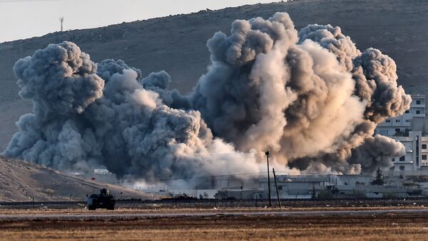 Smoke rises during airstrikes on the Syrian town of Ain al-Arab, known as Kobane by the Kurds - Sputnik International