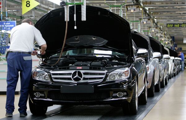 An employee of German car producer Mercedes-Benz controling a Mercedes C-class as it rolls off the production line in the plant in Sindelfingen near Stuttgart, Germany An employee of German car producer Mercedes-Benz controling a Mercedes C-class as it rolls off the production line in the plant in Sindelfingen near Stuttgart, Germany - Sputnik International