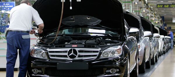 An employee of German car producer Mercedes-Benz controling a Mercedes C-class as it rolls off the production line in the plant in Sindelfingen near Stuttgart, Germany An employee of German car producer Mercedes-Benz controling a Mercedes C-class as it rolls off the production line in the plant in Sindelfingen near Stuttgart, Germany - Sputnik International